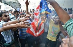 تنديد مصري بموقف امريكا من الثورة وحرق علمها