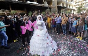 زفاف وسط الركام في مكان تفجير الرويس الارهابي