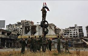 العلم السوري يرفرف في حمص القديمة بعد إخراج المسلحين+صوروفيديو