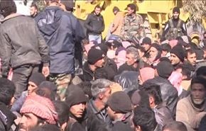 بالفيديو، مع اشتداد المعارك، نحو 500 مسلح يلوذ بالجيش السوري