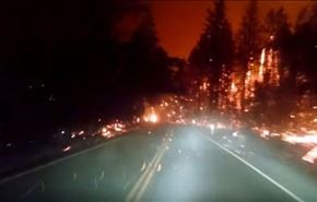فيديو مرعب...سائق يقود مركبته وسط حرائق الغابات باميركا