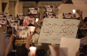 الآلاف يشعلون الشموع في البحرين حزنا على شهداء الكرادة +صور