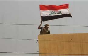 اهتزاز پرچم عراق اطراف یکی از مناطق موصل