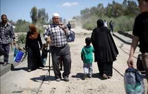 فرار زنان و کودکان از دست داعش +عکس