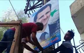 بعد خروج المسلحين منها.. صور الأسد ترفع في هذه المدينة!