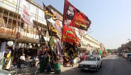 بالصور :رايات الحسين (ع) تزين شوارع بغداد في شهر الحزن