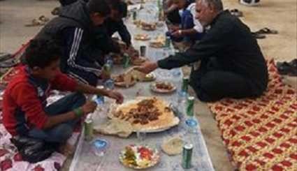 بالصور ...خدمة إطعام زوار الإمام الحسين (ع)