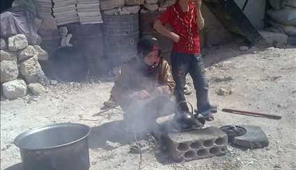 بالصور ...هذا حال أطفال الفوعة وكفريا السورية في برد الشتاء بسبب الإرهاب