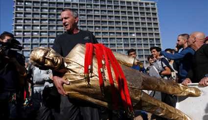 إسقاط تمثال نتنياهو بوسط تل أبيب