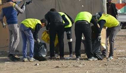 بالصور ..حملة تطوعية لتنظيف طريق الدجيل - سامراء في العراق