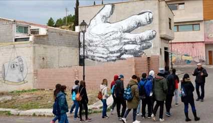 Street art revives divided Spanish village