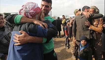 Iraqi Families Reunite outside War-Wracked Mosul