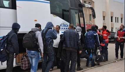 Gunmen, Their Family Members Leave Al-Wa’er Neighborhood in Homs