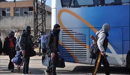 Gunmen, Their Family Members Leave Al-Wa’er Neighborhood in Homs