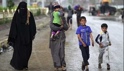 Displaced Iraqis Flee Their Homes in Area West of Mosul