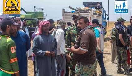 قوات الحشد الشعبي العراقي تعيد نازحي قريتي