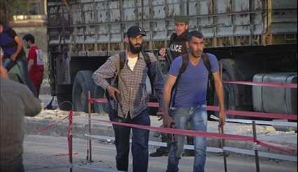Tens of Gunmen, Family Members Evacuated from Northwestern Homs