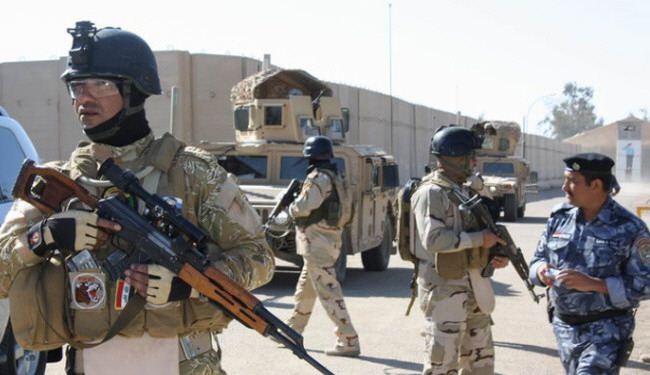 العراق يتهم مسلحين بقتل عشرات الجنود السوريين