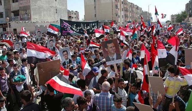 Syrians rally in Homs to back army