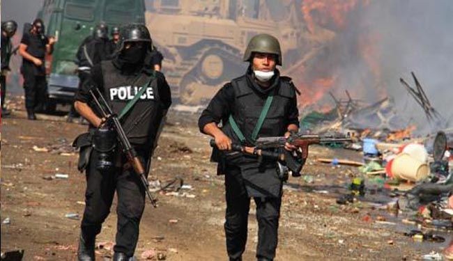 Egypt police raid area near Cairo, one killed