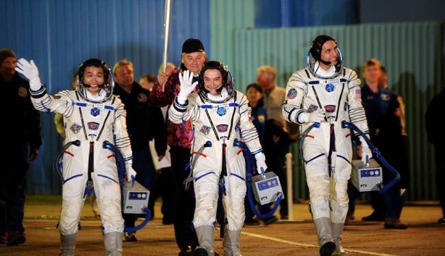 In first, Russia takes Olympic torch into space
