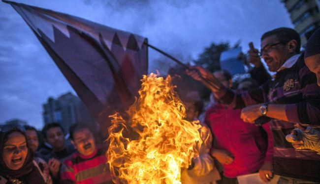 Protesters burn Qatari, Turkish flags in Cairo