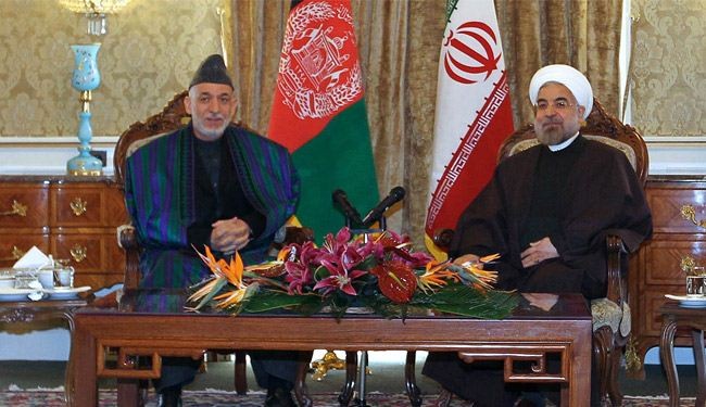 روحاني مستقبلا كرزاي: ايران ترفض أي تواجد اجنبي بالمنطقة