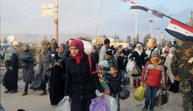 Syrians return home in Muadamiyat al-Sham after militant retreat: Photos