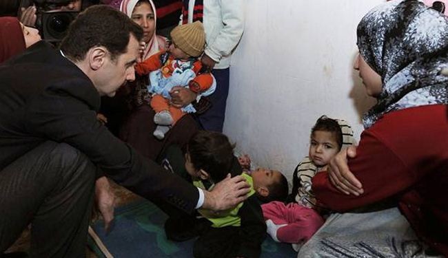 Assad visits displaced Syrians outside Damascus
