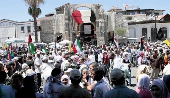 پرچم‌هایی که در روز جهانی قدس در دمشق به اهتزاز درآمد