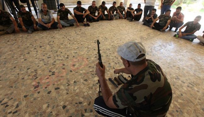 بالصور؛ طلبة واساتذة جامعات العراق يتدربون على السلاح