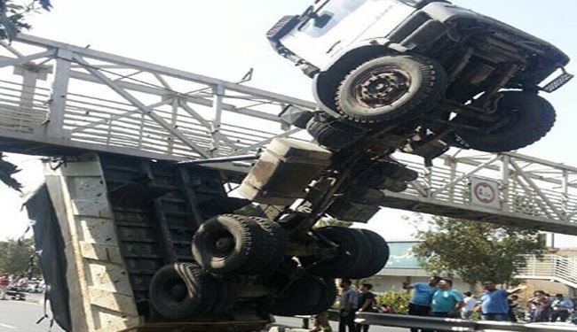 Photos: Truck Hits Pedestrian Bridge in Tehran