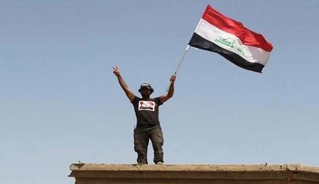 القوات الامنية ترفع العلم العراقي فوق مركز هيت