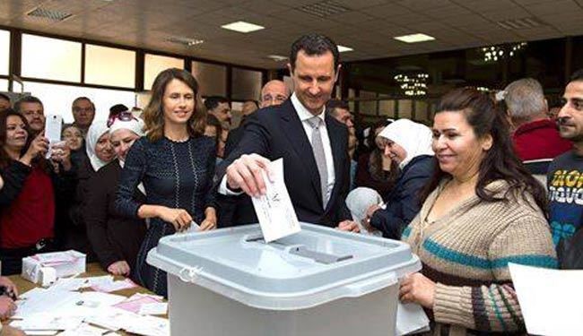 بشار اسد و همسرش در کنار صندوق رأی +عکس