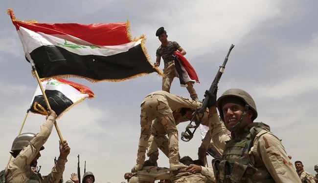 العلم العراقي يرفرف فوق مركز شرطة زخيخية في الانبار
