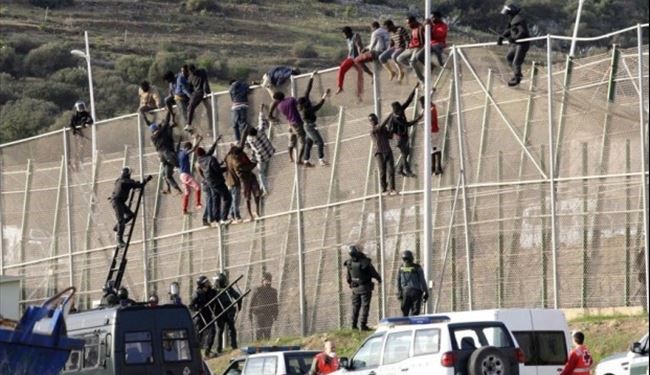 Migrants Storm Spain-Morocco Border Fence