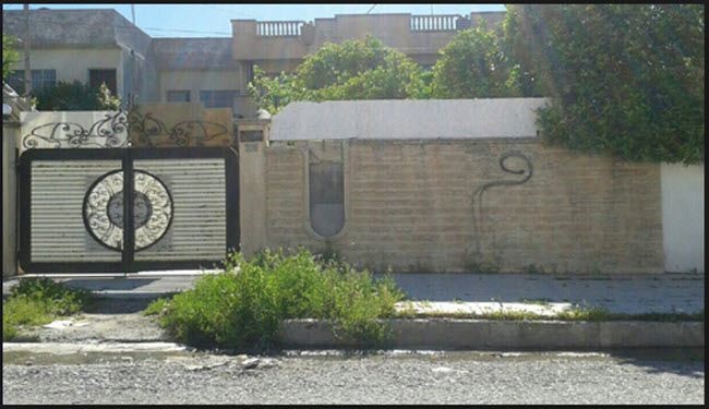 بالصور: أهالي الموصل يكتبون حرف 