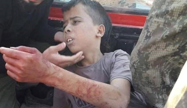 SHOCKING PICS: West Backed Syrian Moderate Rebels Behead a Child