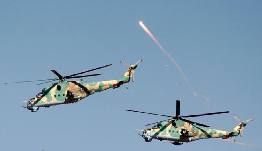 Syrian Military Helicopters Pound Terrorists' Strongholds, Artillery in Dara'a
