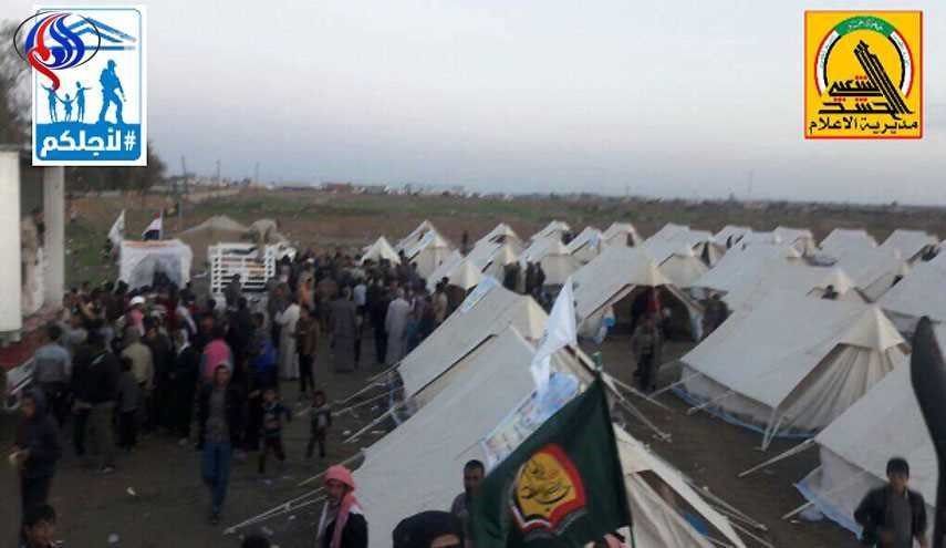 توزیع کمکهای آستان قدس حسینی میان آوارگان موصل
