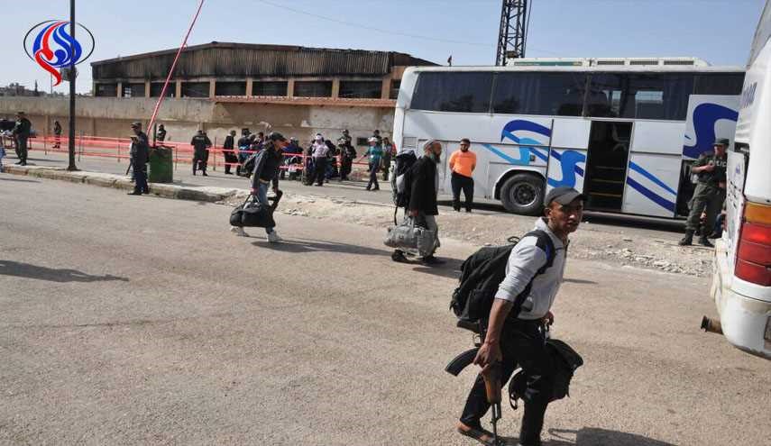 بالصور.. خروج الدفعة السابعة للمسلحين من حي الوعر بحمص