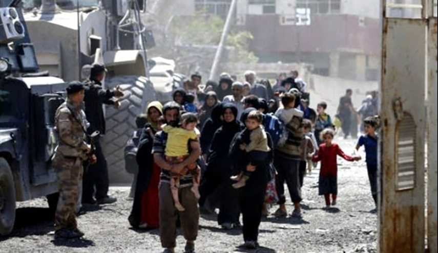 Iraqis Leave Zanjili Neighborhood as Security Forces Continue...