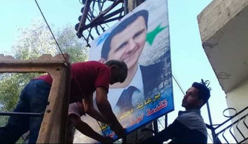 بعد خروج المسلحين منها.. صور الأسد ترفع في هذه المدينة!