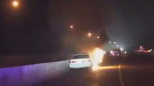 VIDEO: Two Brave Police Officers Pull Out Victim From Burning Car