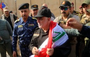 ماذا قال العبادي أثناء رفع العلم العراقي في القائم؟ 