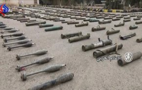 شاهد بالفيديو: داعش تركت هذه الكمية الضخمة من الاسلحة بدير الزور 