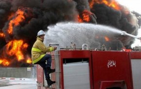 شاهد بالصور.. حريق ضخم يلتهم محال تجارية في بغداد 
