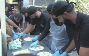 بالفيديو: موائد الطعام على حب الإمام الحسين (ع) في لبنان