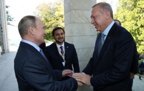 بوتين يبتسم بوجه أردوغان