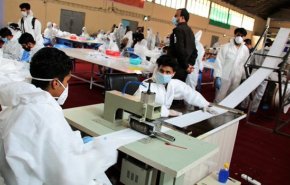 كوادر التعبئة في طهران تنتج ملايين الكمامات الطبية